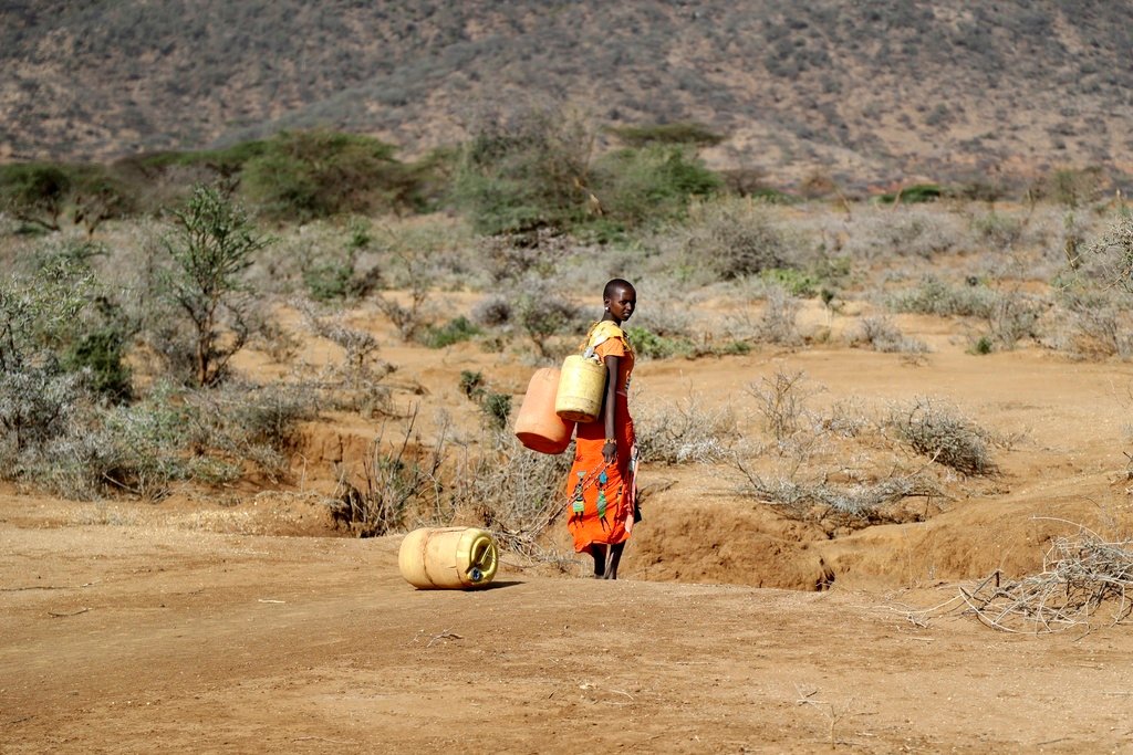 A Samburu woman fetches water during a drought in Loolkuniyani Primary School, Samburu County, Kenya, Oct. 16, 2022. (AP Photo/Brian Inganga, File)