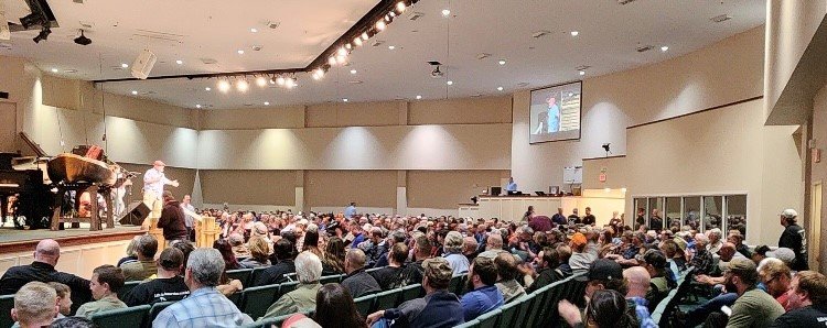 People fill the sanctuary for an evening with professional fisherman Clay Dyer.