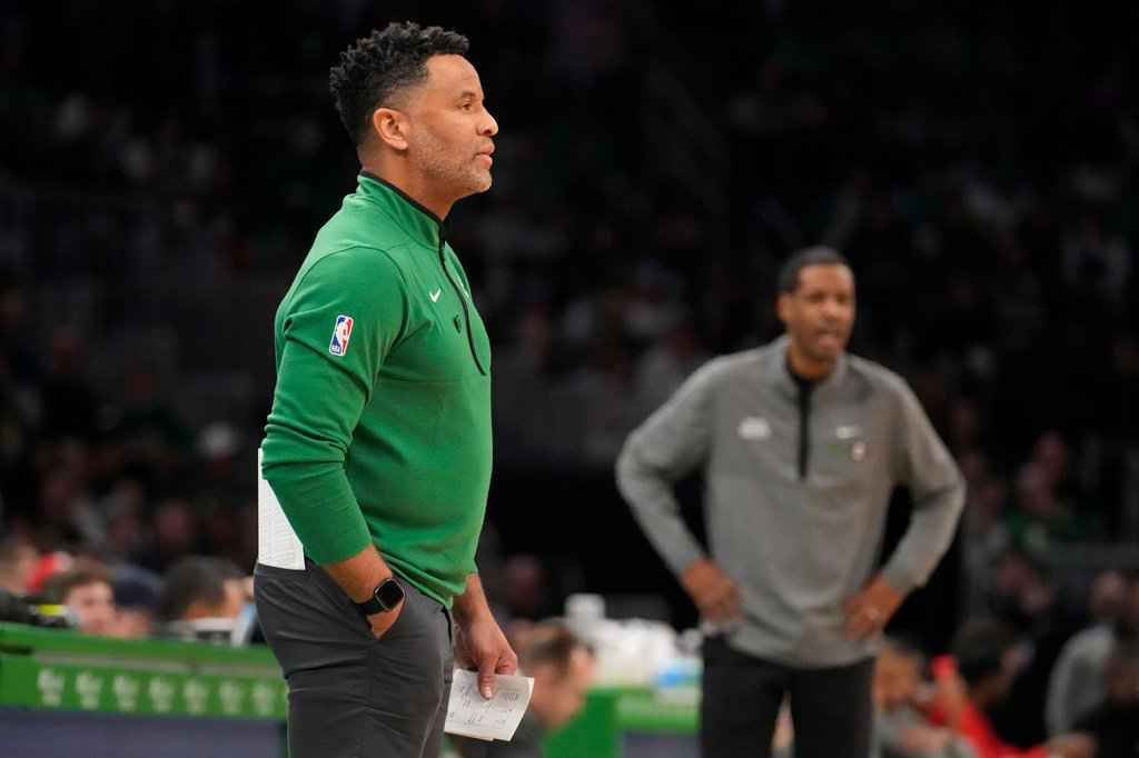 Boston Celtics assistant coach Damon Stoudamire, filling in for interim head coach Joe Mazzulla, draws up a play during a time out in the first half against the Houston Rockets on Dec. 27, 2022, in Boston. (AP Photo/Charles Krupa, File)