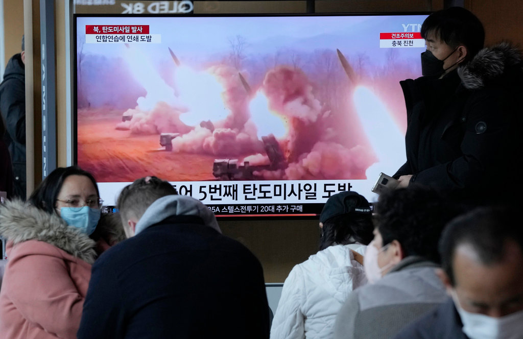A TV screen shows a file image of a North Korean missile launch during a news program at the Seoul Railway Station in Seoul, South Korea, Tuesday, March 14, 2023. (AP Photo/Ahn Young-joon)