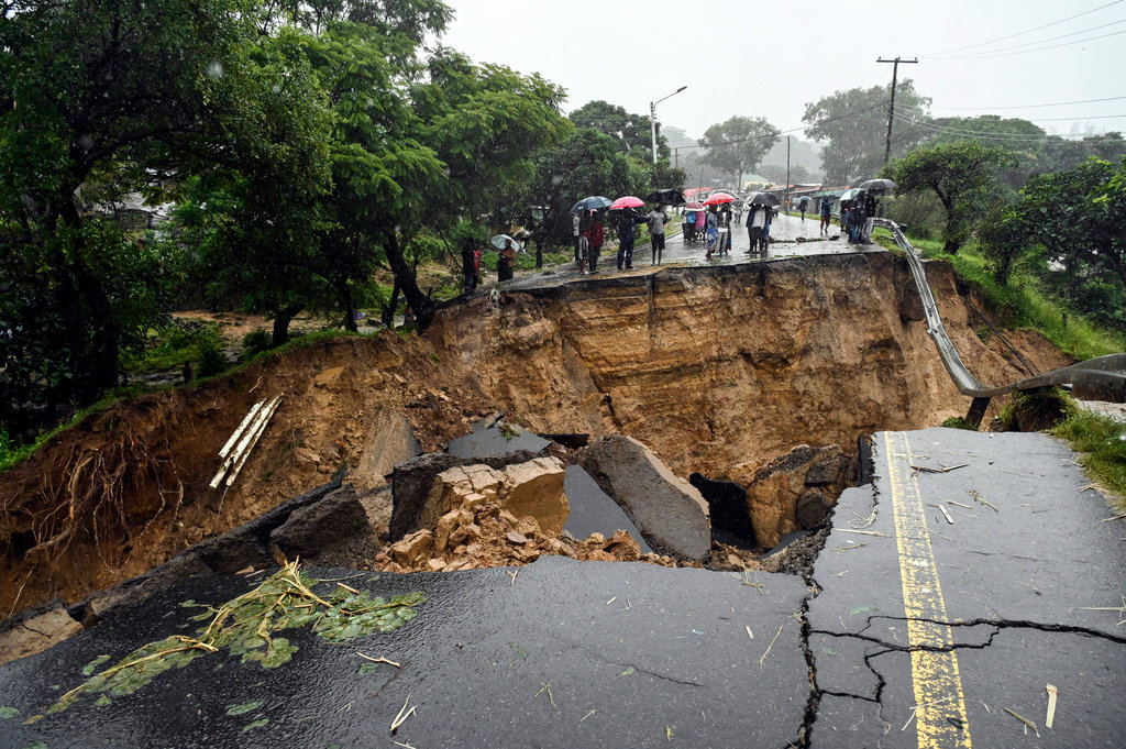 A road connecting the two cities of Blantyre and Lilongwe is seen damaged following heavy rains caused by Tropical Cyclone Freddy in Blantyre, Malawi Tuesday, March 14, 2023. (AP Photo/Thoko Chikondi)