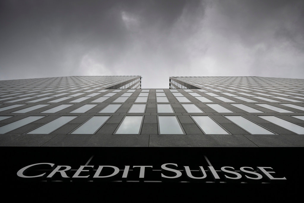 Grey clouds cover the sky over a building of the Credit Suisse bank in Zurich, Switzerland, on Feb. 21, 2022. (Ennio Leanza/Keystone via AP, File)