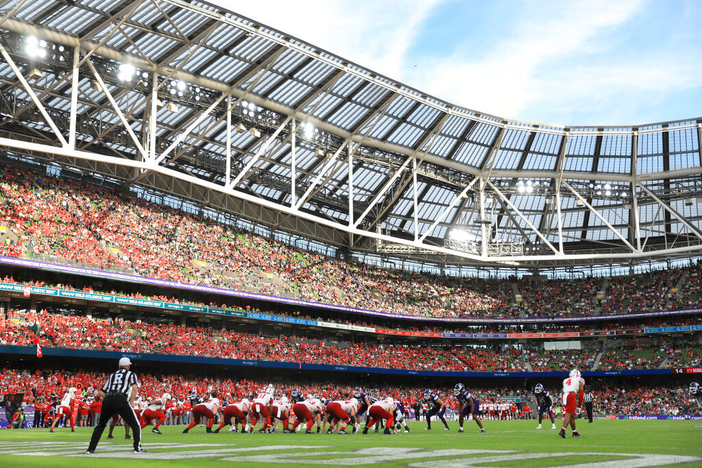 Players get set on the field during the first half of an NCAA college football game between Northwestern and Nebraska, Aug. 27, 2022, at Aviva Stadium in Dublin, Ireland. (AP Photo/Peter Morrison, File)