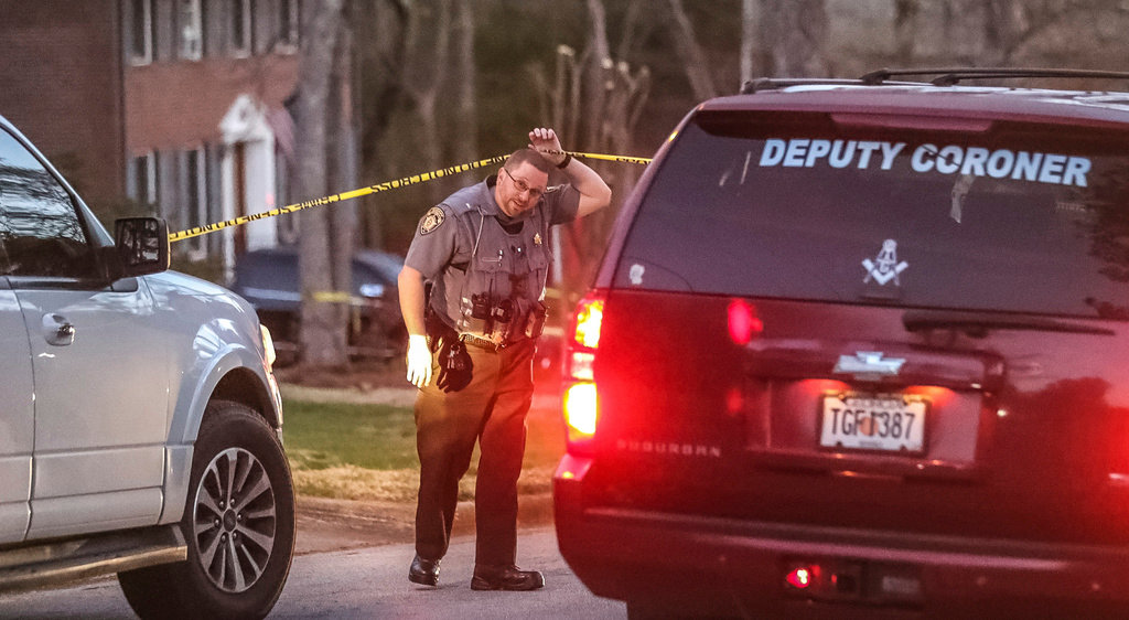 Rockdale County sheriff's deputies are investigating a triple shooting in a residential neighborhood south of Conyers, Ga. on on Monday, March 20, 2023. (John Spink/Atlanta Journal-Constitution via AP)