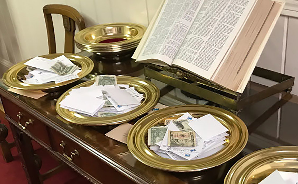 Collection plates are seen at Clarkston International Bible Church.