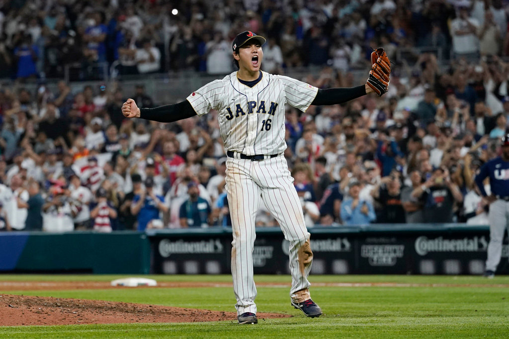 Japan pitcher Shohei Ohtani (16) celebrates after defeating the United States in the final game of the World Baseball Classic, Tuesday, March 21, 2023, in Miami. (AP Photo/Marta Lavandier)