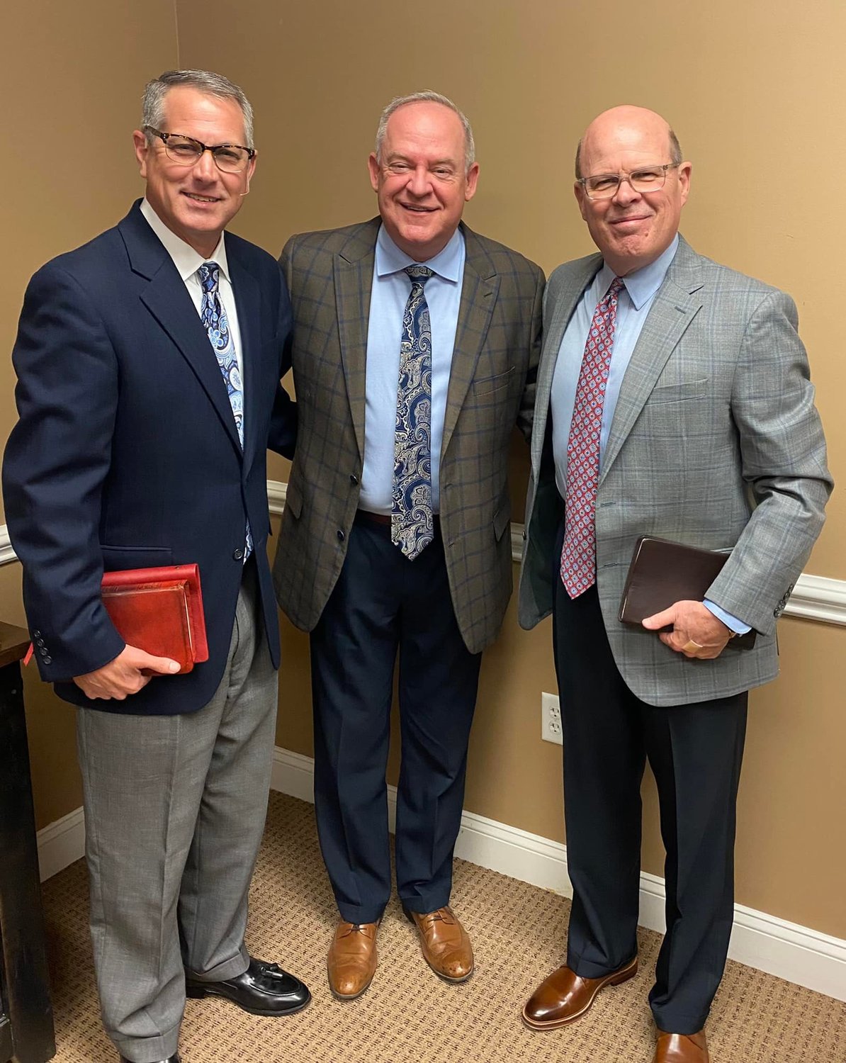 Pastor Brad Waters, left, and Evangelist Rick Coram, right, stand with Robby Foster, pastor of Northside Baptist Church in Valdosta. All three preached at the church's recent Bible conference.