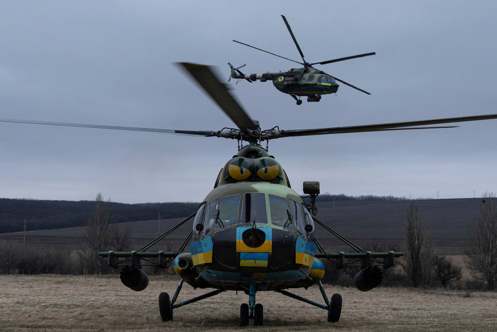 Ukrainian Mi-8 combat helicopters take off towards Russian positions during a combat mission in Donetsk region, Ukraine, Saturday, March 18, 2023. (AP Photo/Evgeniy Maloletka)