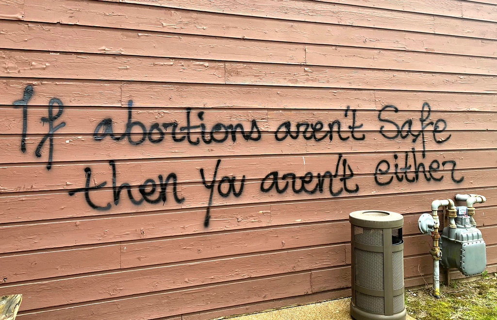 Threatening graffiti is seen on the exterior of Wisconsin Family Action offices in Madison, Wis., May 8, 2022. (Alex Shur/Wisconsin State Journal via AP, File)