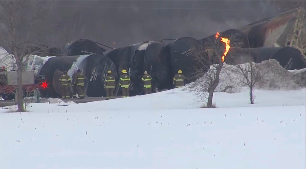 Emergency personnel respond to the scene of a train derailment early Thursday, March 30, 2023, in Raymond, Min.  (KSTP via AP)