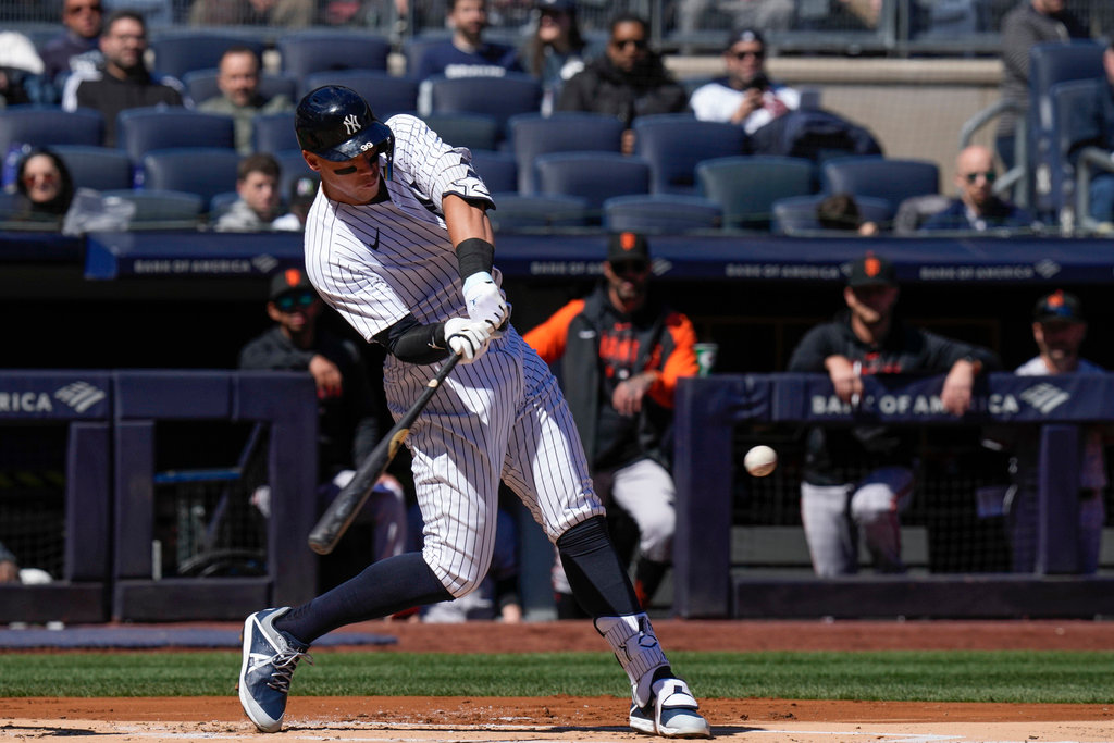 New York Yankees' Aaron Judge hits a solo home run during the first inning against the San Francisco Giants at Yankee Stadium, Thursday, March 30, 2023, in New York. (AP Photo/Seth Wenig)