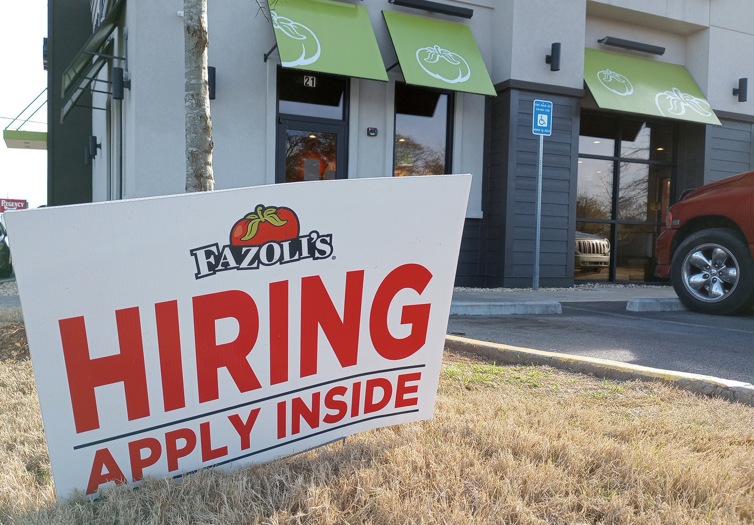 A hiring sign is seen at a restaurant in Cartersville, Ga., March 21, 2023. (Index/Henry Durand, File)