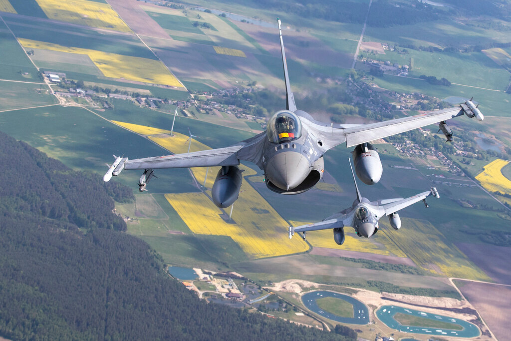 Romanian Air Force F-16 fighter jets participate in NATO's Baltic Air Policing Mission in Lithuanian airspace Monday, May 22, 2023. (AP Photo/Mindaugas Kulbis)