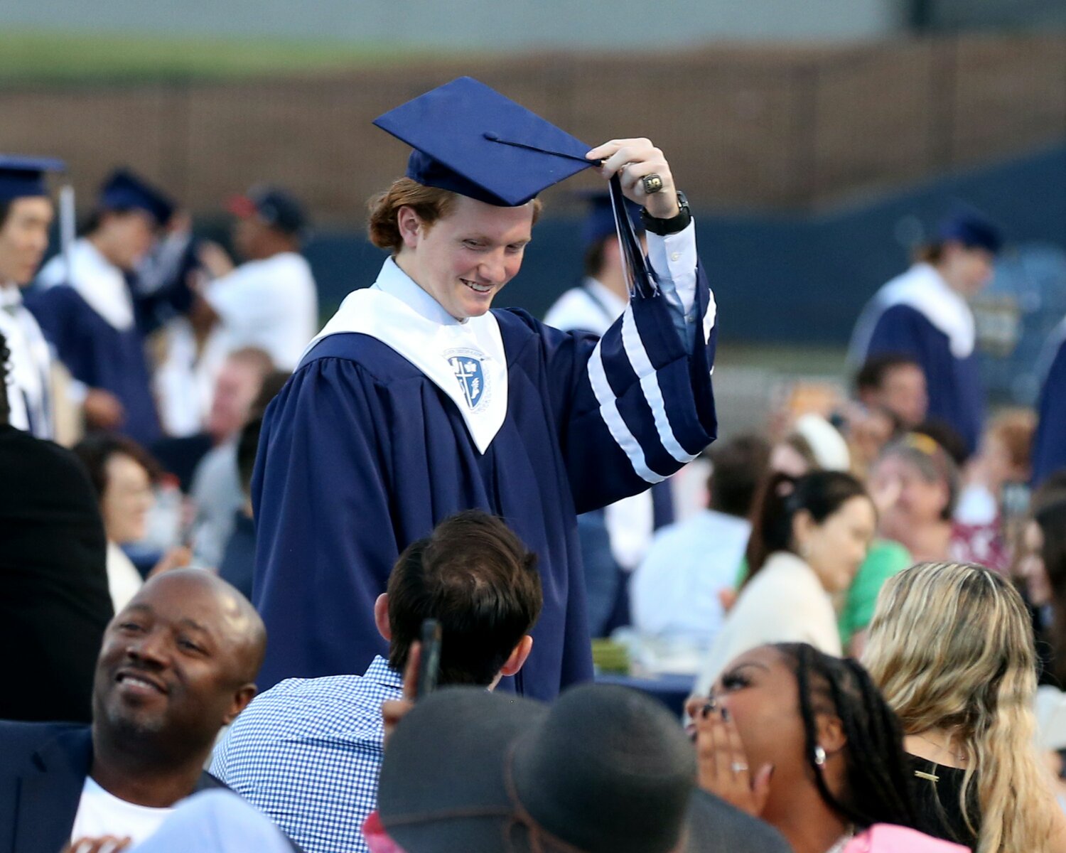 Bobby Buckley adjusts his tassel during graduation exercises at Eagle's Landing Christian Academy on Friday, May 19, 2023. (Photo/Jeff Hurndon)