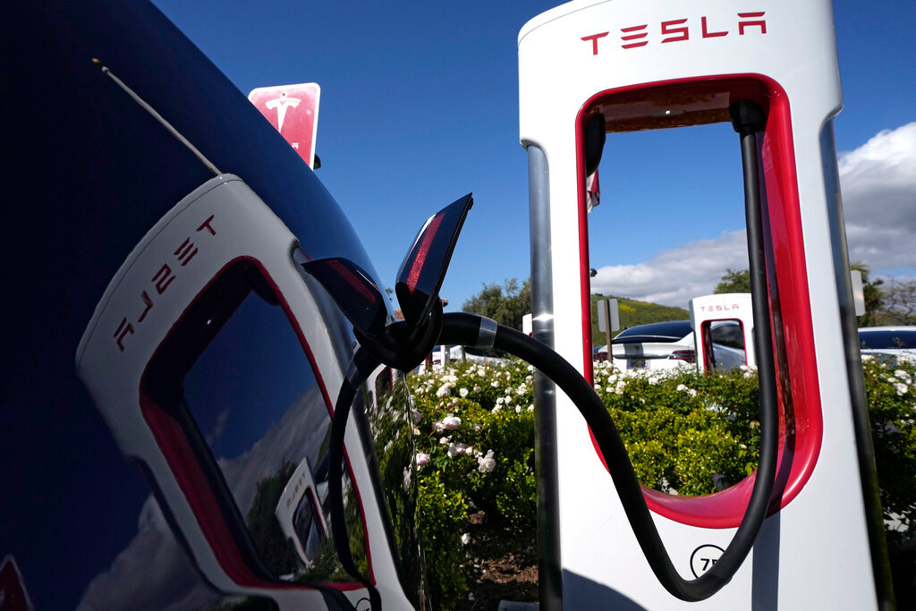 A Tesla auto charges on May 10, 2023, in Westlake, Calif. (AP Photo/Mark J. Terrill, File)