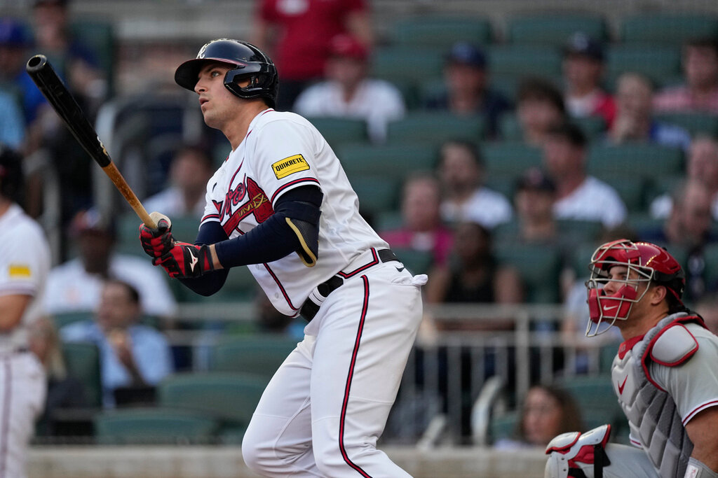 Atlanta Braves' Austin Riley and Philadelphia Phillies catcher J.T. Realmuto watch his two-run home run during the first inning Thursday, May 25, 2023, in Atlanta. (AP Photo/John Bazemore)