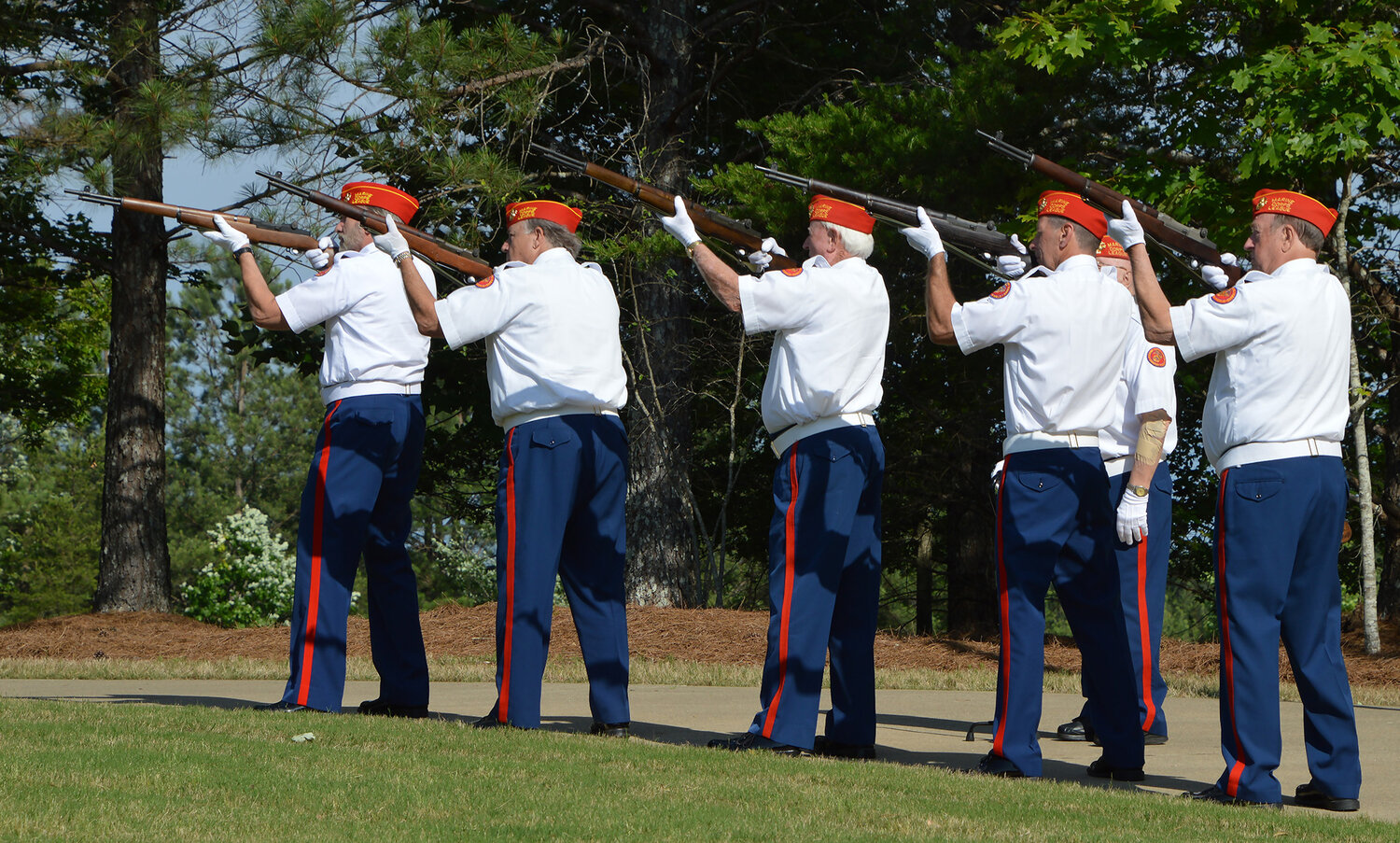Members of Marine Corps League detachment 1311 from Woodstock, Ga., fire a salute during a ceremony at the Georgia National Cemetery in Canton, Ga., Saturday, May 27, 2023. (Index/Henry Durand)