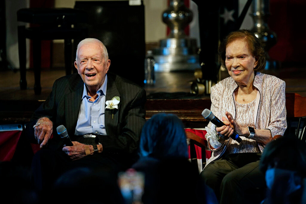 Former President Jimmy Carter and his wife Rosalynn Carter sit together during a reception to celebrate their 75th wedding anniversary on July 10, 2021, in Plains, Ga. (AP Photo/John Bazemore, Pool, File)
