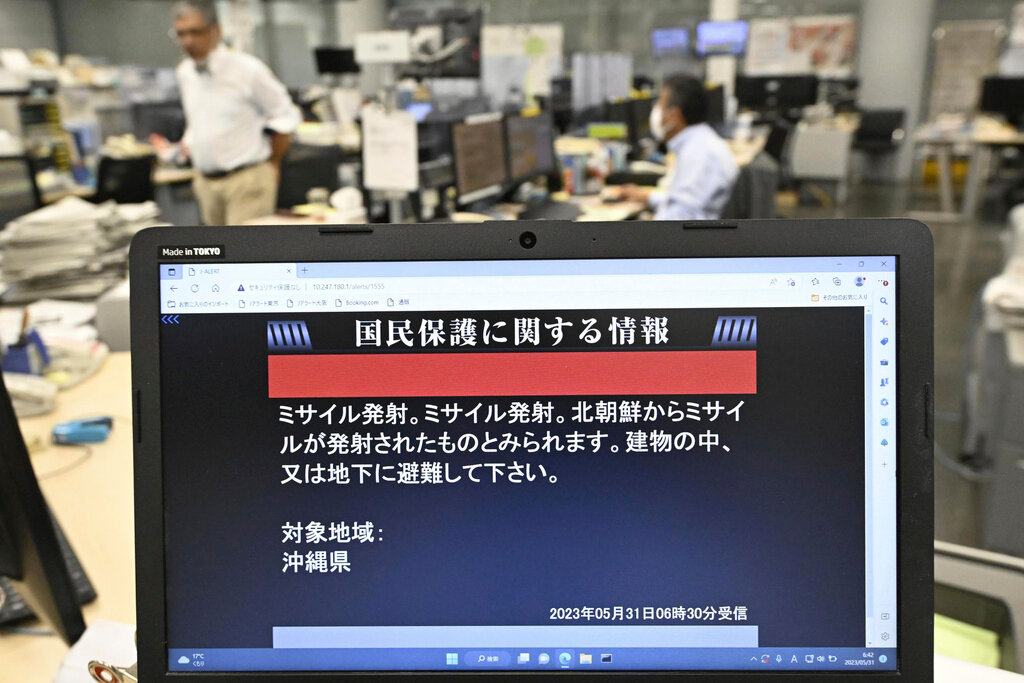 A monitor in Tokyo shows J-Alert or National Early Warning System to the residents in Okinawa, southern Japan, Wednesday, May 31, 2023. (Kyodo News via AP)