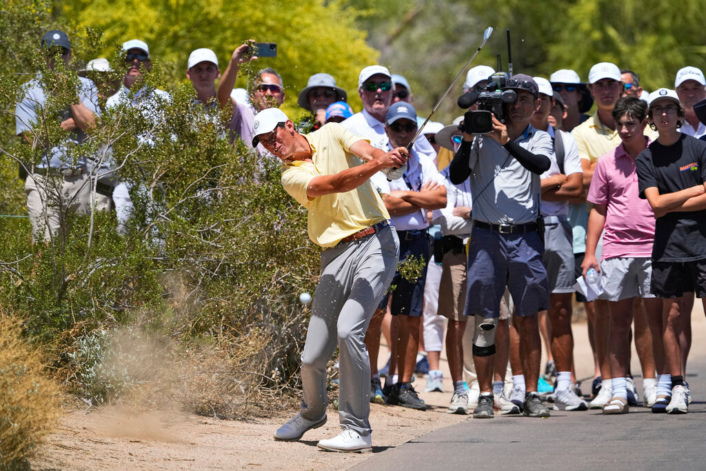 Georgia Tech's Christo Lamprecht hits from along the cart path on the first fairway during the final round of the NCAA championship Wednesday, May 31, 2023, in Scottsdale, Ariz. (AP Photo/Matt York)