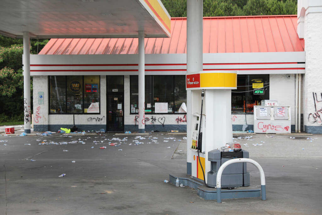 Debris is spread out in front of a convenience store Tuesday, May 30, 2023, in Columbia, S.C. (AP Photo/Jeffrey Collins)