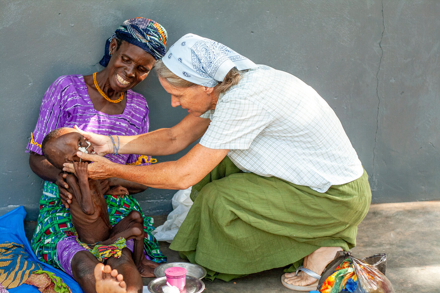 An IMB missionary midwife examines a malnourished Fulani child at the Baptist Medical Centre's Nutritional Rehabilitation Center in Nalerigu, Ghana. (Photo/International Mission Board)