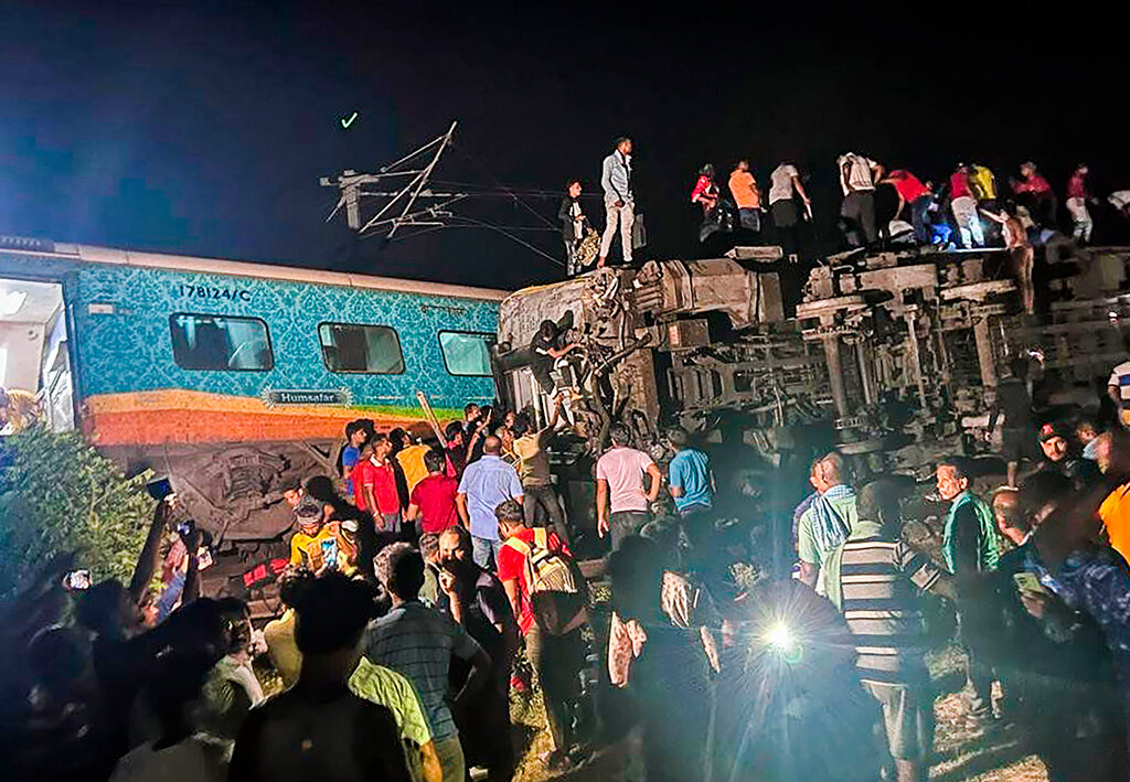 Rescuers work at the site of passenger trains that derailed in Balasore district, in the eastern Indian state of Orissa, Friday, June 2, 2023. (Press Trust of India via AP)