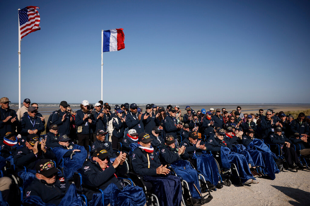 U.S. veterans attend the commemoration organized by the Best Defense Foundation at Utah Beach near Sainte-Marie-du-Mont, Normandy, France, Sunday, June 4, 2023, ahead of the D-Day Anniversary. (AP Photo/Thomas Padilla)