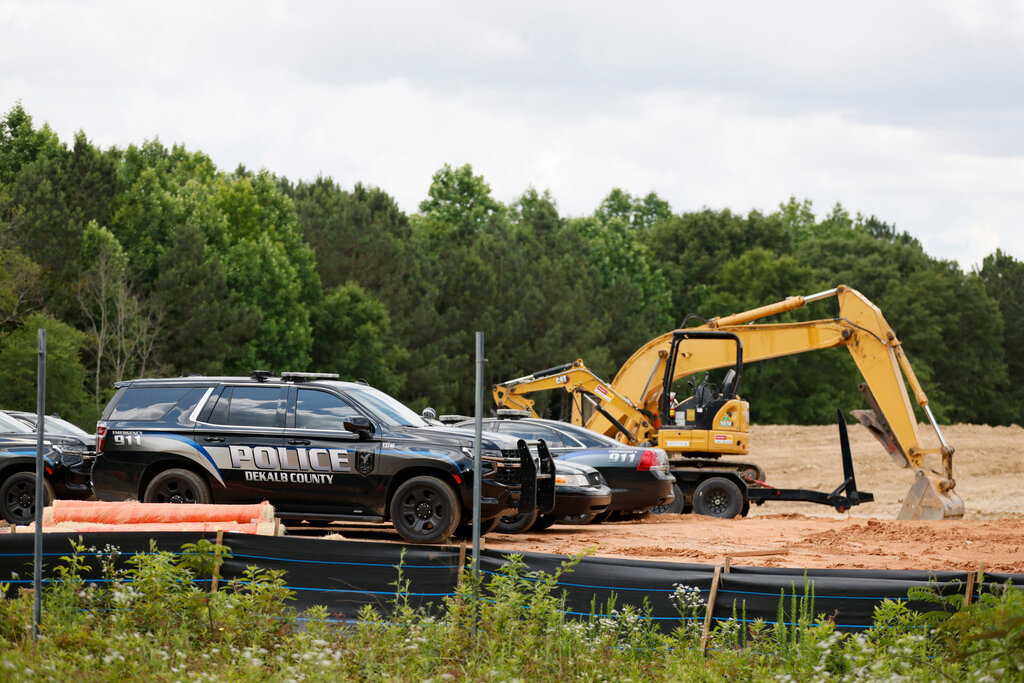 Atlanta Police Department cars are parked at one of the Atlanta Public Safety Training Center construction site entrances on Tuesday, May 30, 2023. (Miguel Martinez/Atlanta Journal-Constitution via AP)