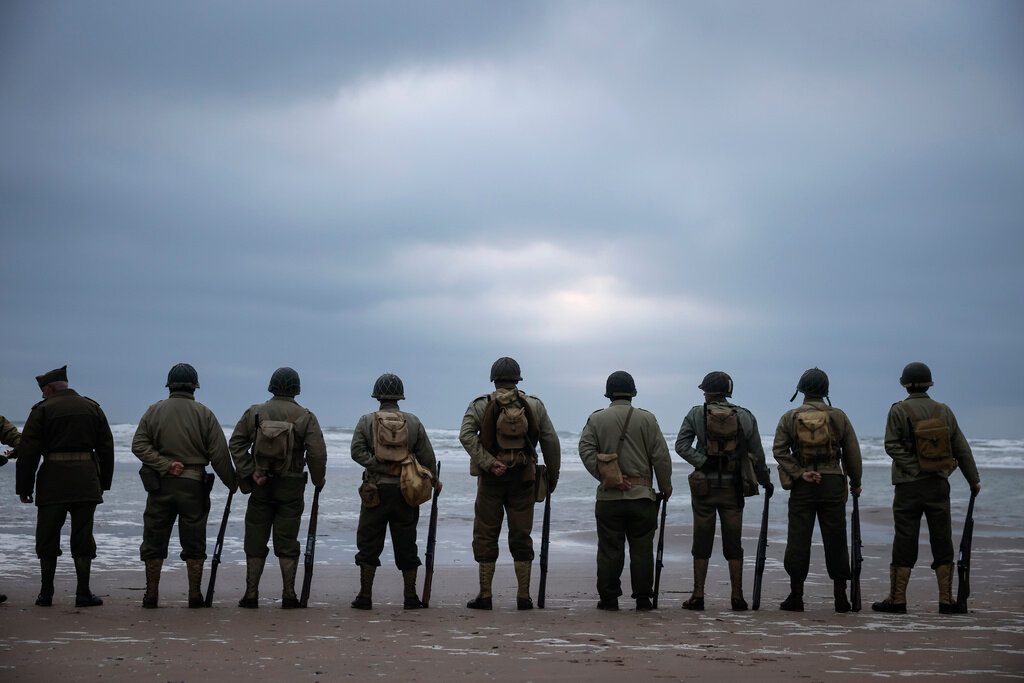 World War II reenactors gather on Omaha Beach in Saint-Laurent-sur-Mer, Normandy, France, Tuesday, June 6, 2023. (AP Photo/Thomas Padilla)