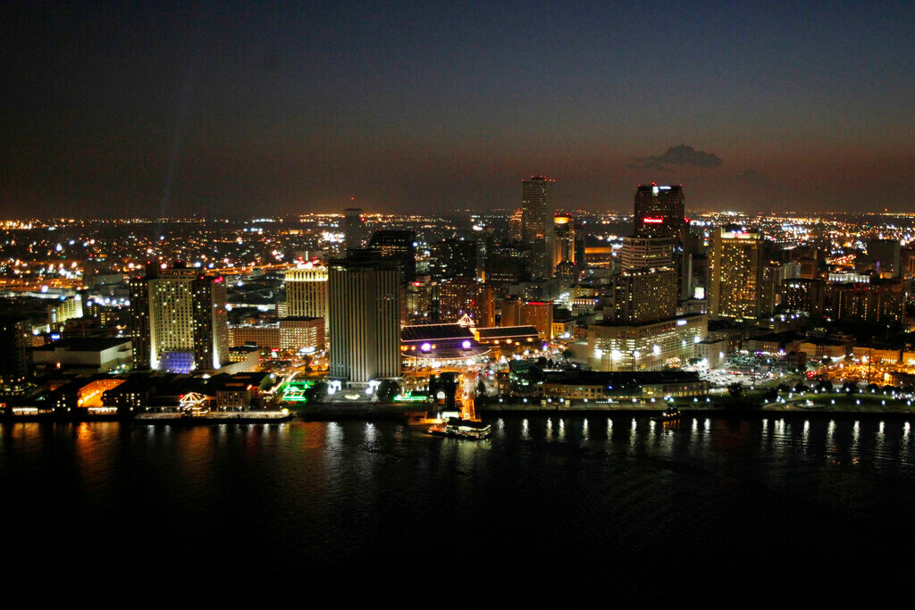 The skyline of New Orleans is seen at night from the air just after sunset. (AP Photo/Gerald Herbert, File)
