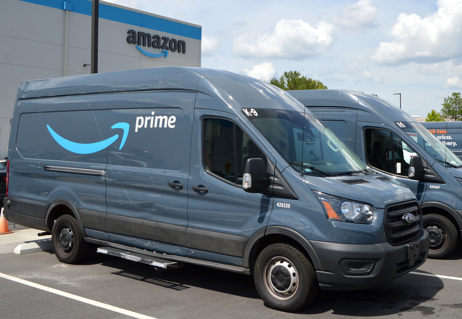 Amazon Prime delivery vehicles sit parked outside a distribution center in Doraville, Ga., July 27, 2022. (Index/Henry Durand, File)