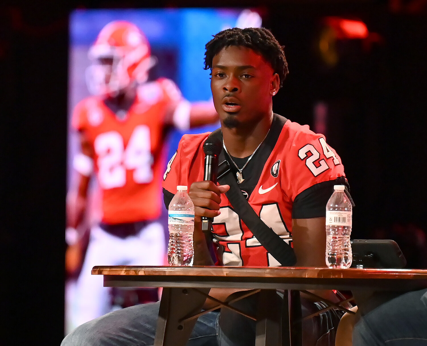 Georgia safety Malaki Starks speaks at the Fellowship of Christian Athletes UGA Night of Champions event on Friday at First Baptist Church of Woodstock. (Index/Henry Durand)