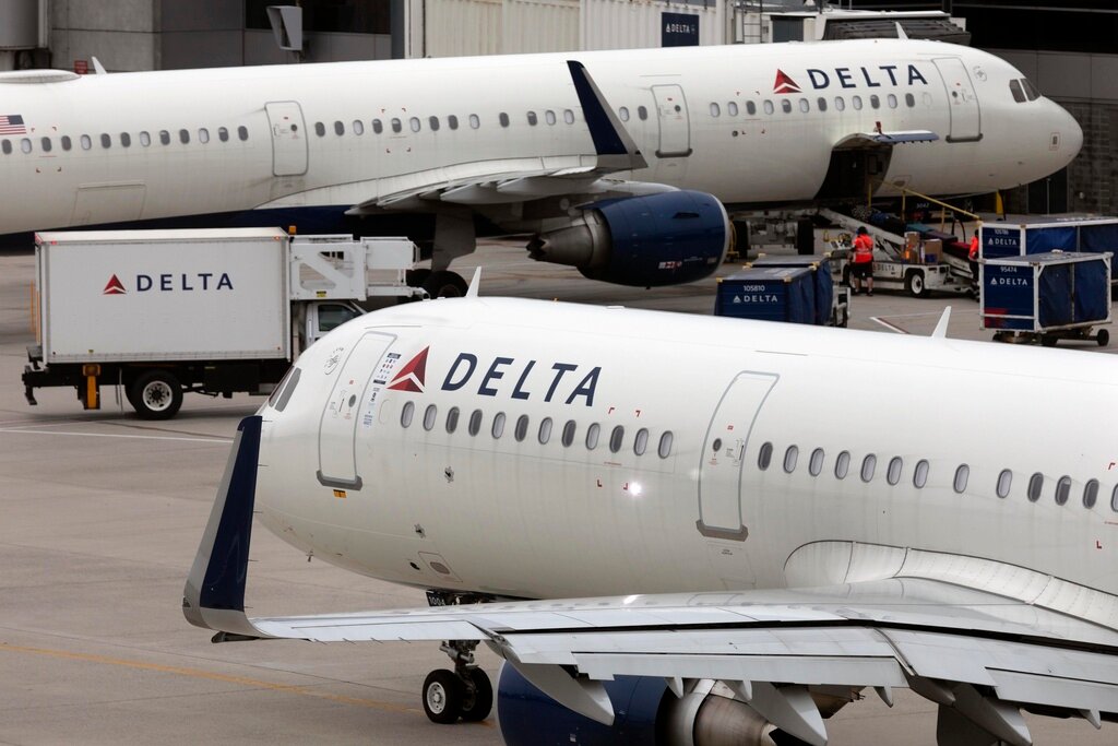 A Delta Airlines plane leaves the gate on July 12, 2021, at Logan International Airport in Boston. (AP Photo/Michael Dwyer, File)
