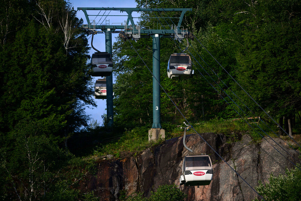 Gondolas are seen at Mont-Tremblant Resort where one person died and another was critically injured after a gondola crashed into a piece of construction equipment, in Mont-Tremblant, Quebec, on Sunday, July 16, 2023. (Justin Tang/The Canadian Press via AP)