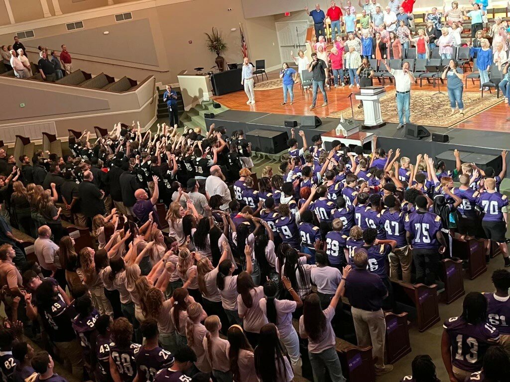 Student athletes from across Carroll County, Ga., worship together at Gridiron Day.