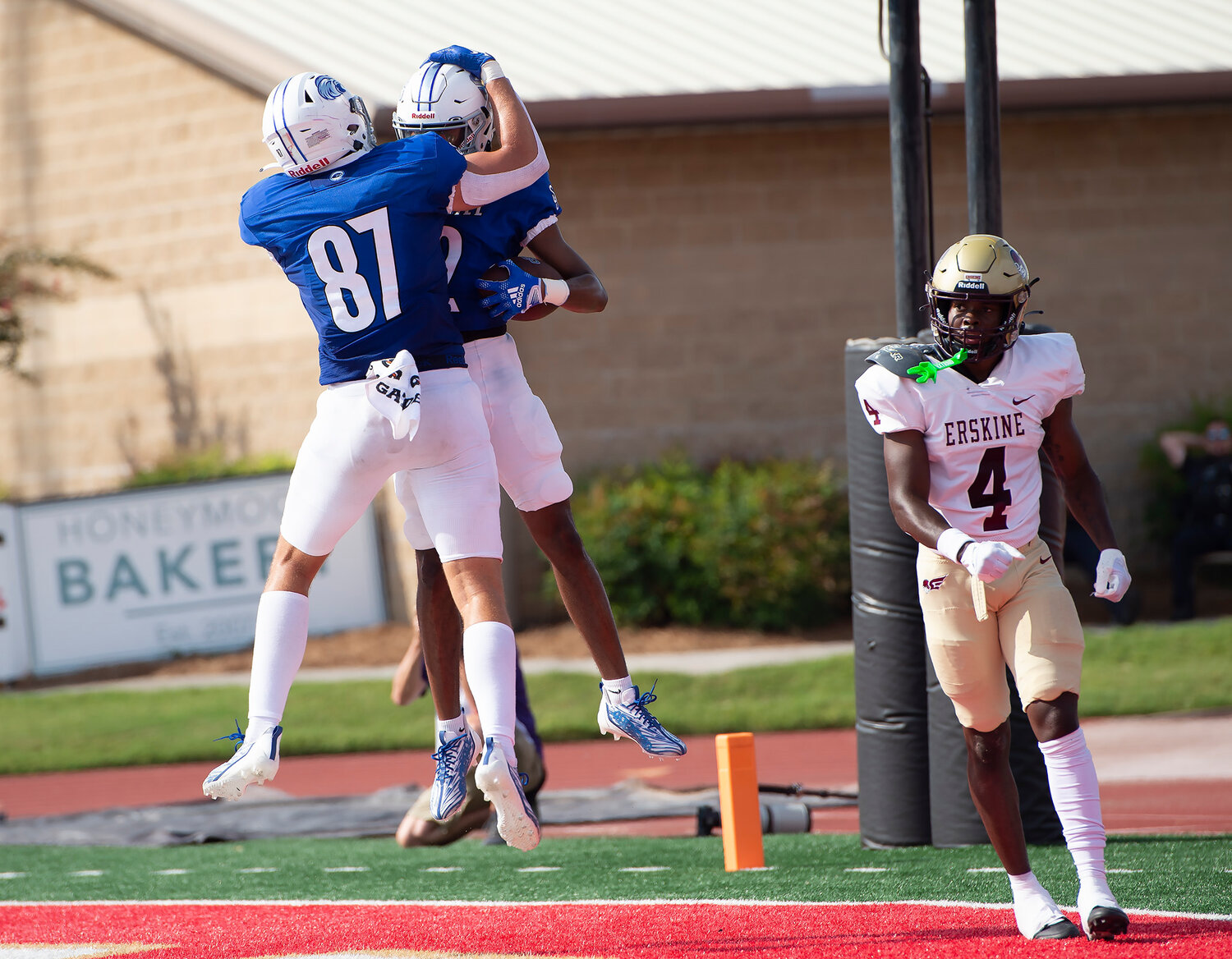 Shorter University's Devon Lewis celebrates with teammate John Dietl III (87) behind Erskine College's Joseph Gilmore (4)  after pulling in a touchdown reception in the second quarter Saturday, Sept. 9, 2023, in Rome, Ga. Shorter won 28-7. (Index/Henry Durand)
