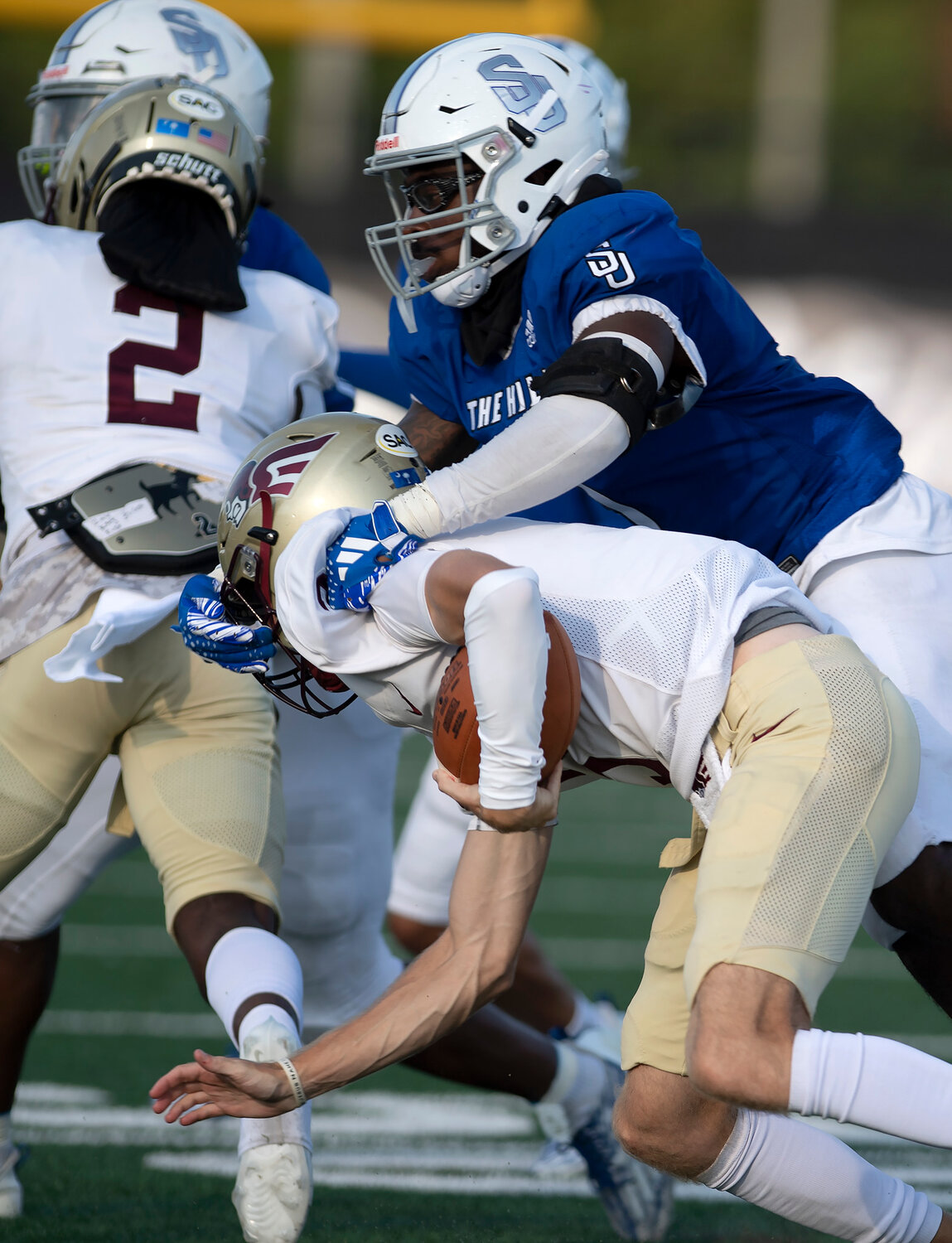 Shorter University defensive lineman Josue Alexander grabs the facemask of Erskine College qarterback Austin Parker in the fourth quarter Saturday, Sept. 9, 2023, in Rome, Ga. Alexander was called for a penalty on the play. Shorter won 28-7. (Index/Henry Durand)
