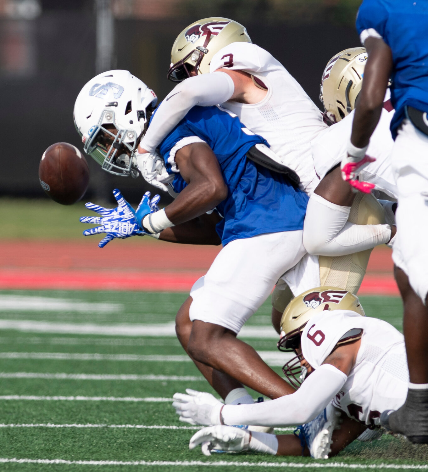 Shorter University wide receiver Jaylin Marshall fumbles as he is tackled by Erskine College's Caleb Gleason and Donovan Bush (6) in the third quarter Saturday, Sept. 9, 2023, in Rome, Ga. The ball went out of bounds and Shorter retained possession. Shorter won 28-7. (Index/Henry Durand)