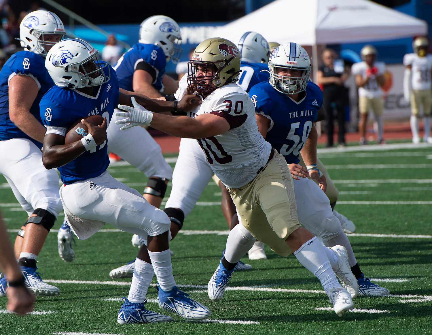 Shorter University quarterback Joshua Brown (12) eludes the tackle by Erskine College's Miller Shouse (3) in the second quarter Saturday, Sept. 9, 2023, in Rome, Ga. Brown was able to get away for a short gain. Shorter won 28-7. (Index/Henry Durand)