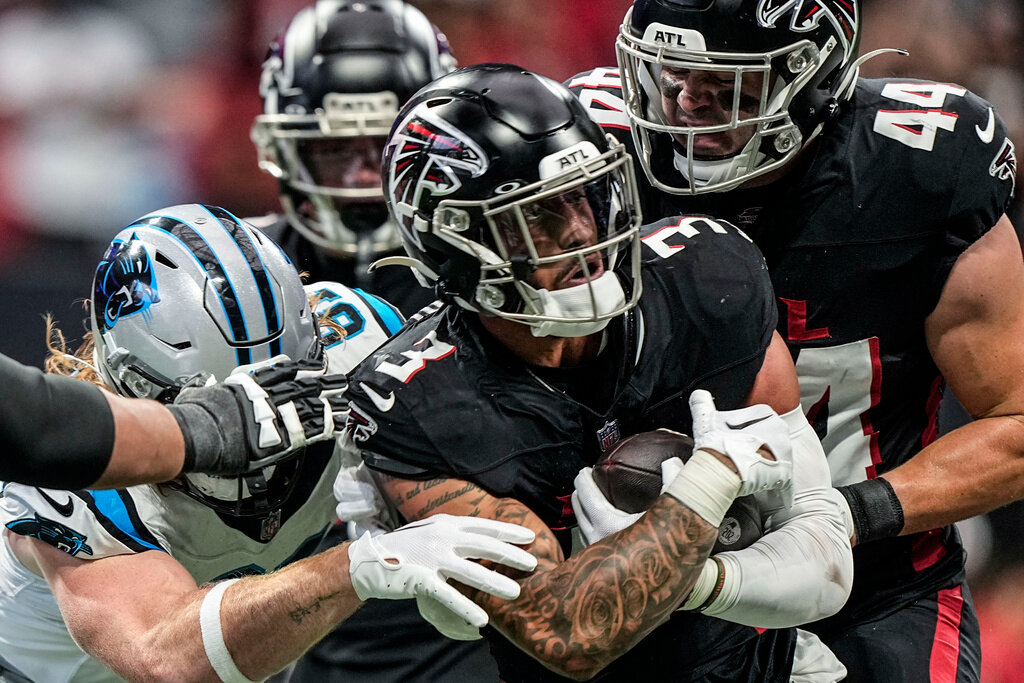 Atlanta Falcons safety Jessie Bates III (3) runs after recovering a fumble against the Carolina Panthers during the first half Sunday, Sept. 10, 2023, in Atlanta. (AP Photo/Brynn Anderson)