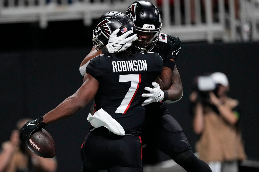 Atlanta Falcons running back Bijan Robinson (7) celebrates his touchdown during the first half against the Carolina Panthers, Sunday, Sept. 10, 2023, in Atlanta. (AP Photo/John Bazemore)