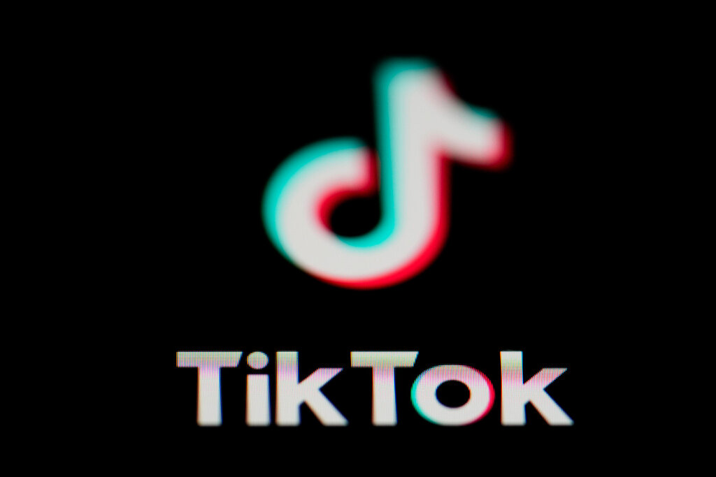 The icon for the video sharing TikTok app is seen on a smartphone. (AP Photo/Matt Slocum, File)