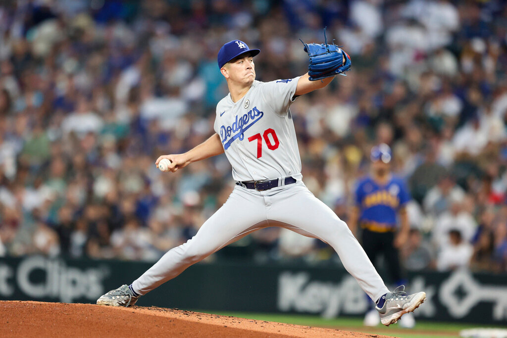 Los Angeles Dodgers starting pitcher Bobby Miller throws against the Seattle Mariners during the first inning of a baseball game Friday, Sept. 15, 2023, in Seattle. (AP Photo/Maddy Grassy)