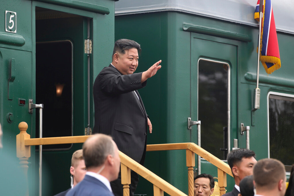 North Korea's leader Kim Jong Un waves as he boards his train prior to leaving Artyom, Russia, Sunday, Sept. 17, 2023. (Government of Primorsky Krai Region via AP)