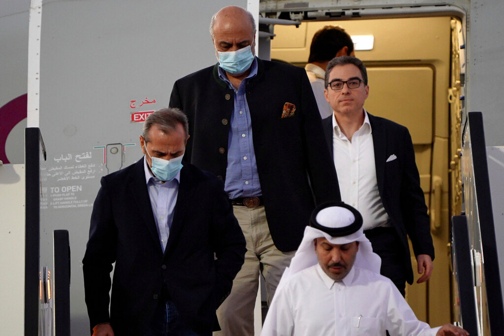 From left, Emad Sharghi, Morad Tahbaz and Siamak Namazi, former prisoners in Iran, arrive in Doha, Qatar, Monday, Sept. 18, 2023. (AP Photo/Lujain Jo)