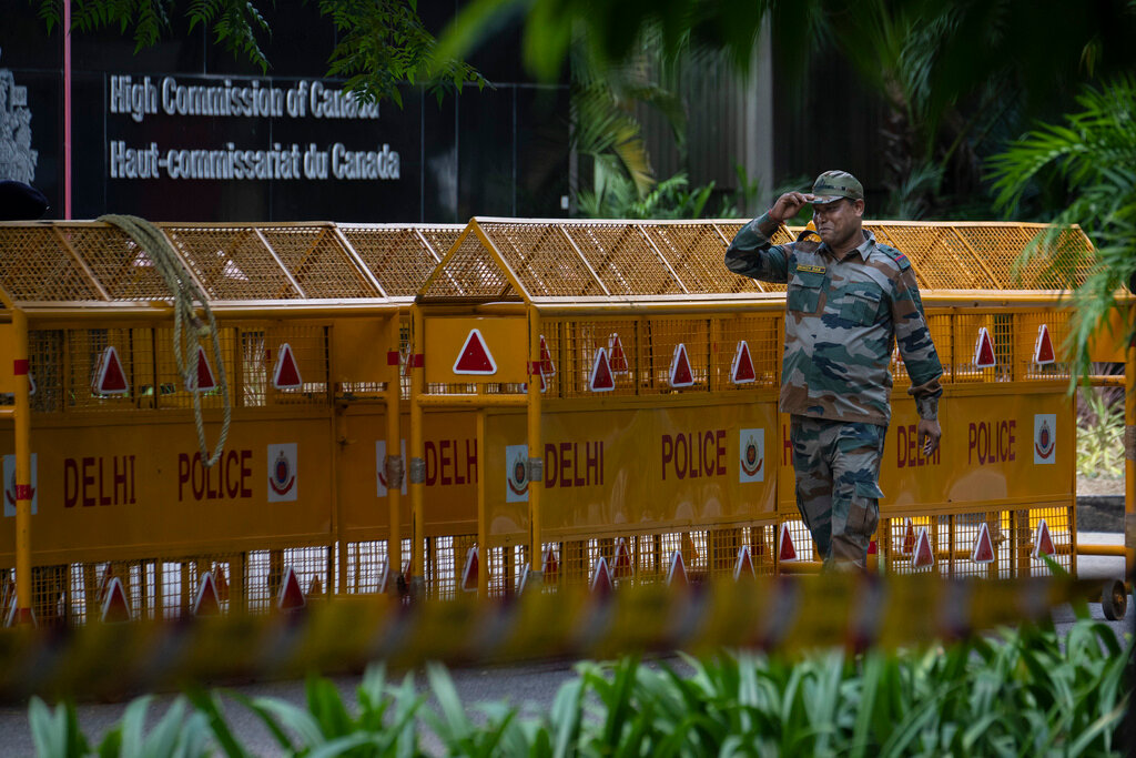 An Indian paramilitary soldier stands guard next to a police barricade outside the Canadian High Commission in New Delhi, India, Tuesday, Sept. 19, 2023.(AP Photo/Altaf Qadri)