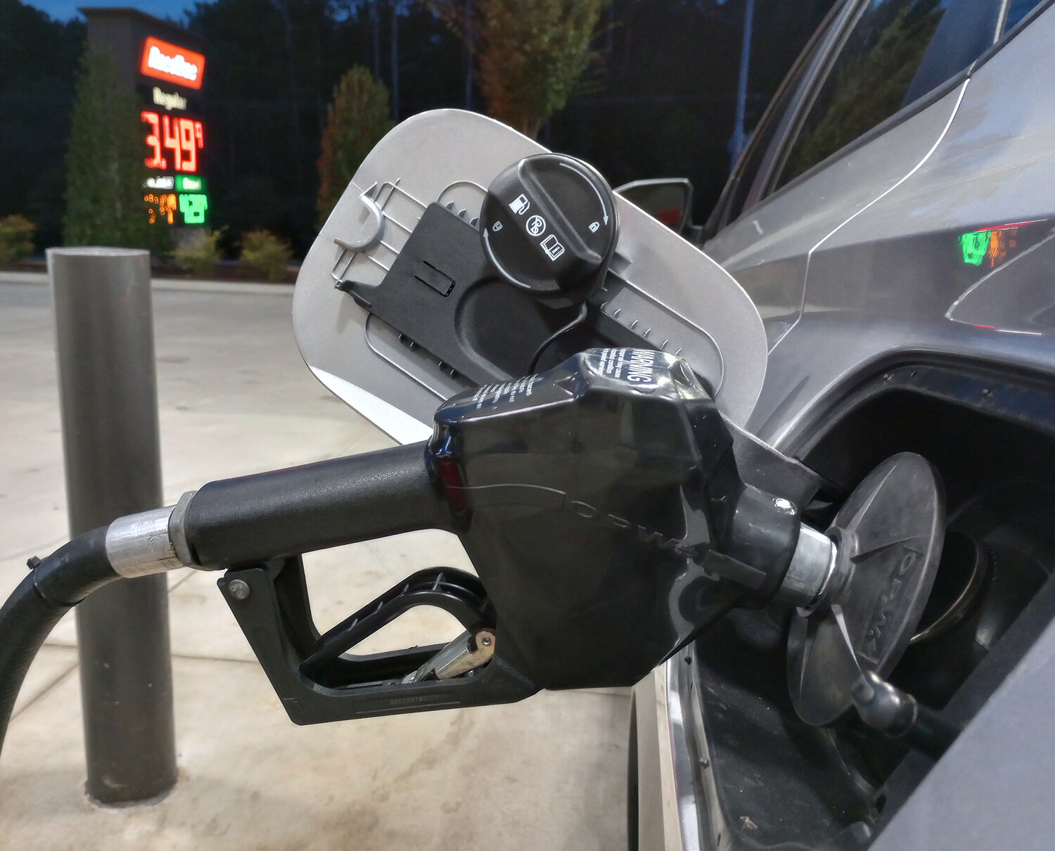 A motorist fills his tank at a gas station in Dallas, Ga., Sept. 13, 2023. (Index/Henry Durand, File)
