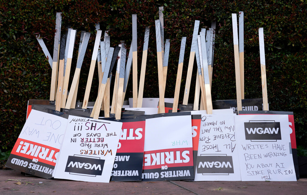 Placards are gathered at the close of a picket by members of The Writers Guild of America outside Walt Disney Studios, May 2, 2023, in Burbank, Calif. (AP Photo/Chris Pizzello, File)