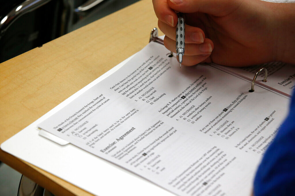A student looks at questions during a college test preparation class in Bethesda, Md. (AP Photo/Alex Brandon, File)